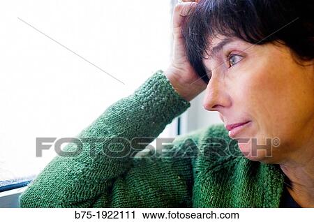 woman leaning on a window, watching and resting View Large Photo Image Stock Image - woman leaning on a window, watching and resting. Fotosearch
