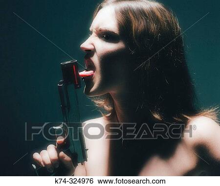 Stock Photograph - Woman Licking Gun. Fotosearch