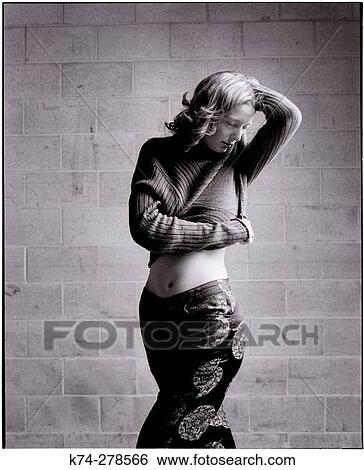 Woman Lifting Her Sweater View Large Photo Image Stock Photograph - Woman Lifting Her Sweater. Fotosearch