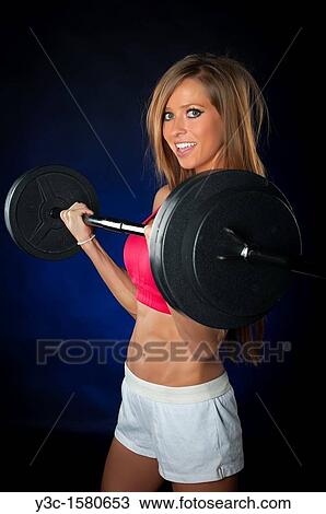 Woman lifting weights View Large Photo Image Stock Image - Woman lifting weights. Fotosearch