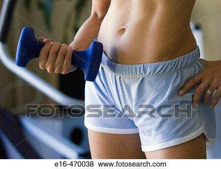 Woman lifting weights View Large Photo Image Stock Photo - Woman lifting weights. Fotosearch