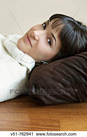 woman listening to musica at home View Large Photo Image Stock Image - woman listening to musica at home. Fotosearch