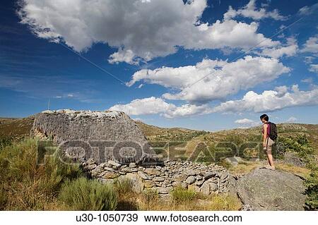Woman looking at a tradicional cabin in Navalosa, Sierra De Gredos? vila Castilla y Le? n Spain View Large Photo Image Stock Photo - Woman looking at a tradicional cabin in Navalosa, Sierra De Gredos? vila Castilla y Le? n Spain. Fotosearch