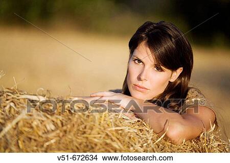 Woman looking at camera in the countryside View Large Photo Image Picture - Woman looking at camera in the countryside. Fotosearch