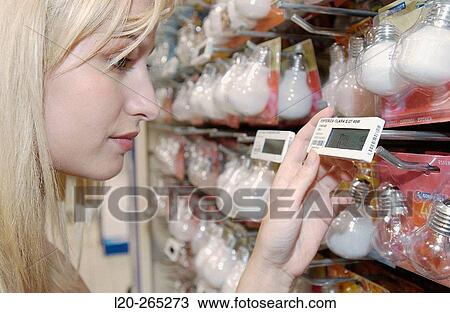 Woman looking at electronic price displays at Eroski shopping center. These displays are updated by remote control. Urbil. Usurbil. Guipuzcoa. Basque Country. Spain View Large Photo Image Stock Image - Woman looking at electronic price displays at Eroski shopping center. These displays are updated by remote control. Urbil. Usurbil. Guipuzcoa. Basque Country. Spain. Fotosearch