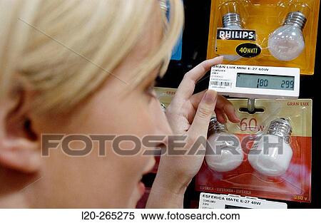Woman looking at electronic price displays at Eroski shopping center. These displays are updated by remote control. Urbil. Usurbil. Guipuzcoa. Basque Country. Spain View Large Photo Image Stock Photography - Woman looking at electronic price displays at Eroski shopping center. These displays are updated by remote control. Urbil. Usurbil. Guipuzcoa. Basque Country. Spain. Fotosearch