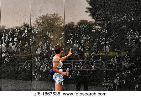 Woman looking at faces and reflections in wall in of platoon at new Korean War Veterans Memorial in Mall in Washington DC in USA View Large Photo Image Stock Photo - Woman looking at faces and reflections in wall in of platoon at new Korean War Veterans Memorial in Mall in Washington DC in USA. Fotosearch