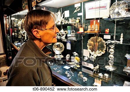 Woman looking gold, silver and jewel in Bruce Russel shop in St Saviours Guernsey, Channel Islands, UK View Large Photo Image Stock Image - Woman looking gold, silver and jewel in Bruce Russel shop in St Saviours Guernsey, Channel Islands, UK. Fotosearch