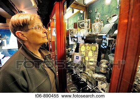 Woman looking gold, silver and jewel in Bruce Russel shop in St Saviours Guernsey, Channel Islands, UK View Large Photo Image Stock Photography - Woman looking gold, silver and jewel in Bruce Russel shop in St Saviours Guernsey, Channel Islands, UK. Fotosearch