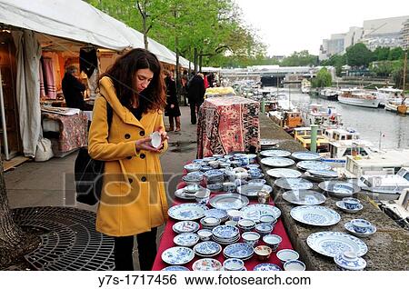 Woman looking obsolete objects in antique market in Bastille, Paris, France, Europe View Large Photo Image Stock Photograph - Woman looking obsolete objects in antique market in Bastille, Paris, France, Europe. Fotosearch