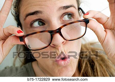 Woman looking over glasses View Large Photo Image Stock Photo - Woman looking over glasses. Fotosearch