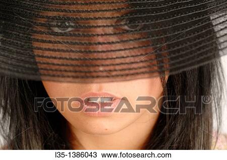 Woman looking through transparent brim View Large Photo Image Stock Image - Woman looking through transparent brim. Fotosearch