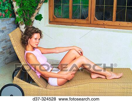 Woman lounging View Large Photo Image Stock Photo - Woman lounging. Fotosearch