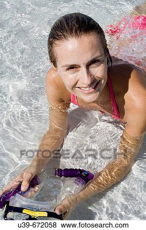 Woman lying in shallow water, holding a snorkel. Fraser Island, Australia View Large Photo Image Stock Photo - Woman lying in shallow water, holding a snorkel. Fraser Island, Australia. Fotosearch
