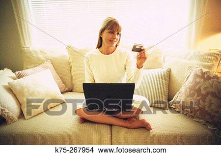 Woman making a purchase on line View Large Photo Image Picture - Woman making a purchase on line. Fotosearch