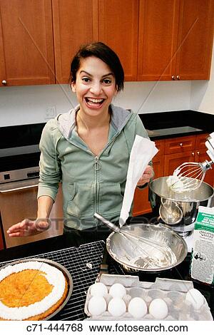 Woman making cake View Large Photo Image Stock Photo - Woman making cake. Fotosearch