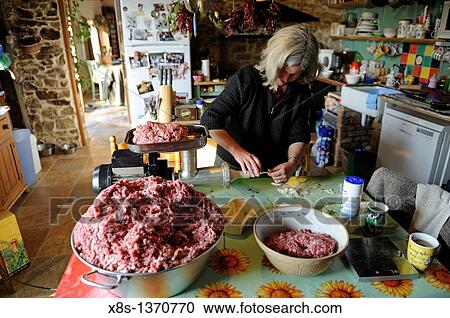 Woman making homemade sausages View Large Photo Image Stock Image - Woman making homemade sausages. Fotosearch