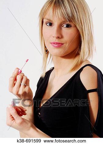Woman making-up View Large Photo Image Stock Photo - Woman making-up. Fotosearch