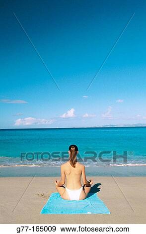 Woman making yoga, at Colombier Bay, St. Barthelemy, Caribbean View Large Photo Image Stock Photo - Woman making yoga, at Colombier Bay, St. Barthelemy, Caribbean. Fotosearch