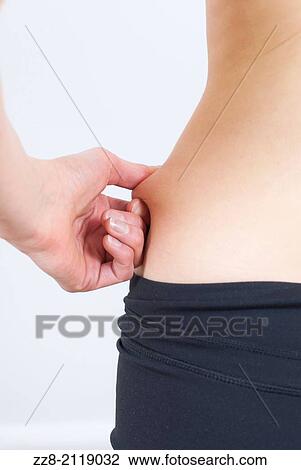 Woman measuring fat on waist. View Large Photo Image Stock Image - Woman measuring fat on waist.. Fotosearch