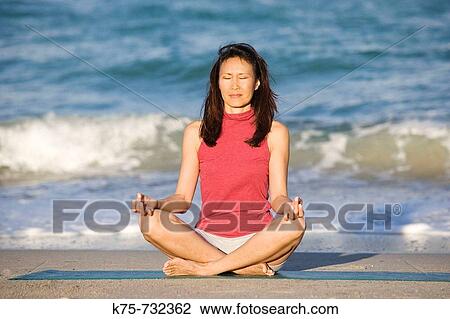woman meditating at beach View Large Photo Image Stock Image - woman meditating at beach. Fotosearch