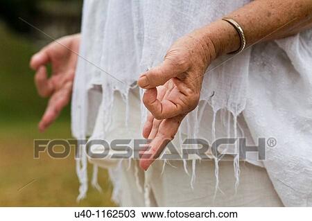 Stock Image - Woman meditating, close up. Fotosearch