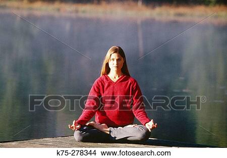 woman meditating outdoors View Large Photo Image Picture - woman meditating outdoors. Fotosearch