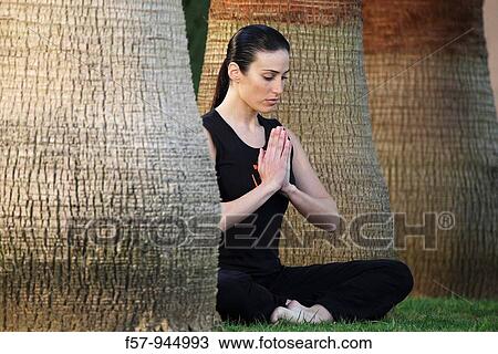Woman meditating View Large Photo Image Stock Image - Woman meditating. Fotosearch