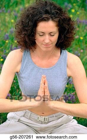 Woman meditating View Large Photo Image Stock Image - Woman meditating. Fotosearch