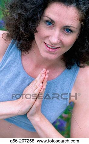 Stock Photo - Woman meditating. Fotosearch