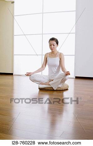 Woman meditating View Large Photo Image Stock Photo - Woman meditating. Fotosearch