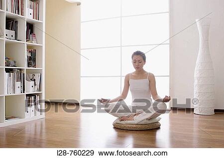 Stock Photo - Woman meditating. Fotosearch