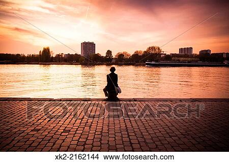 woman meditation in front of the river, Antwerp, Belgium View Large Photo Image Picture - woman meditation in front of the river, Antwerp, Belgium. Fotosearch