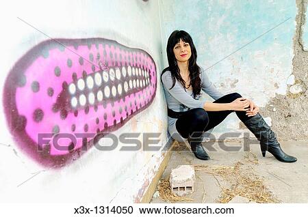 Woman model posing by wall graffiti Rome Italy View Large Photo Image Stock Image - Woman model posing by wall graffiti Rome Italy. Fotosearch