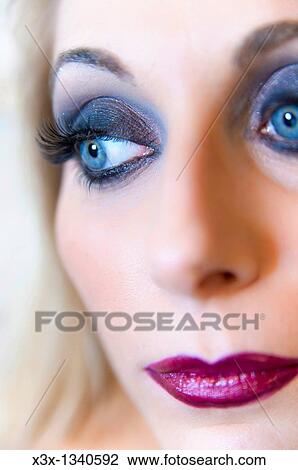 Woman model with makeup looking away View Large Photo Image Stock Image - Woman model with makeup looking away. Fotosearch