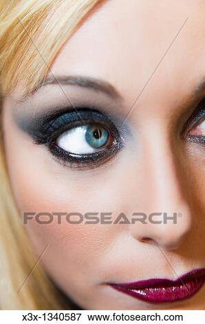 Woman model with makeup looking away View Large Photo Image Stock Photo - Woman model with makeup looking away. Fotosearch