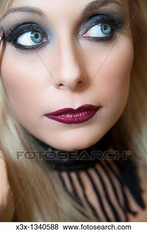 Stock Photo - Woman model with makeup looking away. Fotosearch