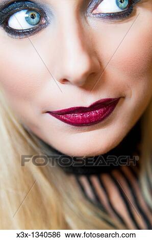 Woman model with makeup looking away View Large Photo Image Stock Photograph - Woman model with makeup looking away. Fotosearch