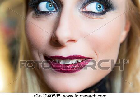 Woman model with makeup looking away and smiling View Large Photo Image Stock Photography - Woman model with makeup looking away and smiling. Fotosearch