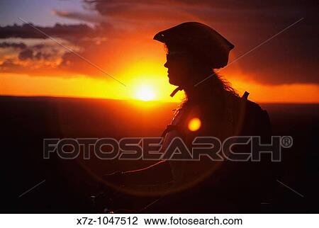 Woman mountain biking The Deadline Ridge Trail at sunset which is located high in The Goose Creek Mountains Idaho USA View Large Photo Image Stock Image - Woman mountain biking The Deadline Ridge Trail at sunset which is located high in The Goose Creek Mountains Idaho USA. Fotosearch