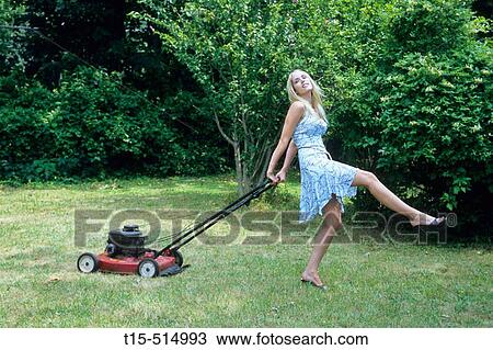 Woman mowing lawn and dancing View Large Photo Image Stock Image - Woman mowing lawn and dancing. Fotosearch