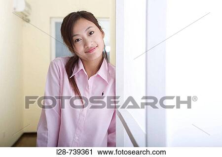 Woman Near window looking at camera View Large Photo Image Stock Image - Woman Near window looking at camera. Fotosearch