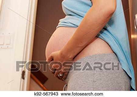 Woman nine months pregnant View Large Photo Image Stock Image - Woman nine months pregnant. Fotosearch