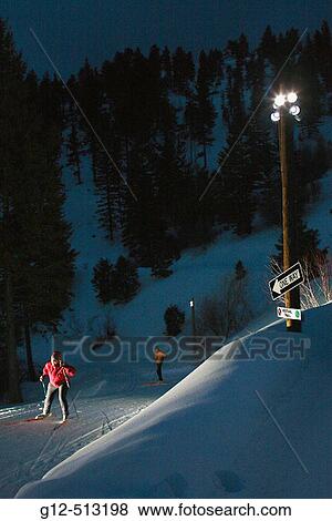Woman nordic skiing at night. View Large Photo Image Stock Photo - Woman nordic skiing at night.. Fotosearch