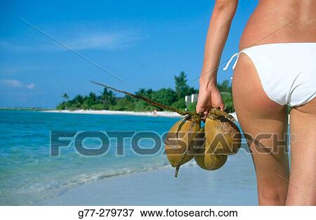 Woman on a beach. Ari Atoll, Maldives View Large Photo Image Stock Photo - Woman on a beach. Ari Atoll, Maldives. Fotosearch