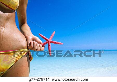 Woman on a beach in Ari Atoll. Maldives View Large Photo Image Picture - Woman on a beach in Ari Atoll. Maldives. Fotosearch