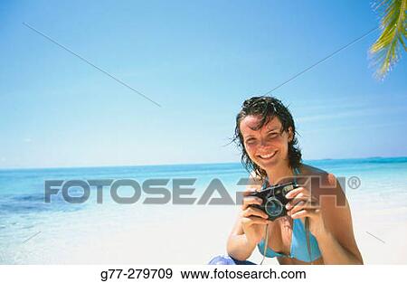 Stock Photo - Woman on a beach. White Sands Resort and Spa. Ari Atoll. Maldives. Fotosearch