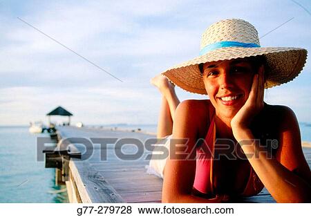 Woman on a beach. White Sands Resort and Spa. Ari Atoll, Maldives View Large Photo Image Stock Photo - Woman on a beach. White Sands Resort and Spa. Ari Atoll, Maldives. Fotosearch