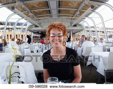 Woman on a dinner cruise on the St. Lawrence in Montreal, Quebec. Canada View Large Photo Image Stock Photo - Woman on a dinner cruise on the St. Lawrence in Montreal, Quebec. Canada. Fotosearch