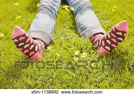Woman on a green lawn with decorative socks View Large Photo Image Stock Image - Woman on a green lawn with decorative socks. Fotosearch